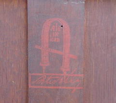 Close-up 1903 large red decal on back of bookcase.